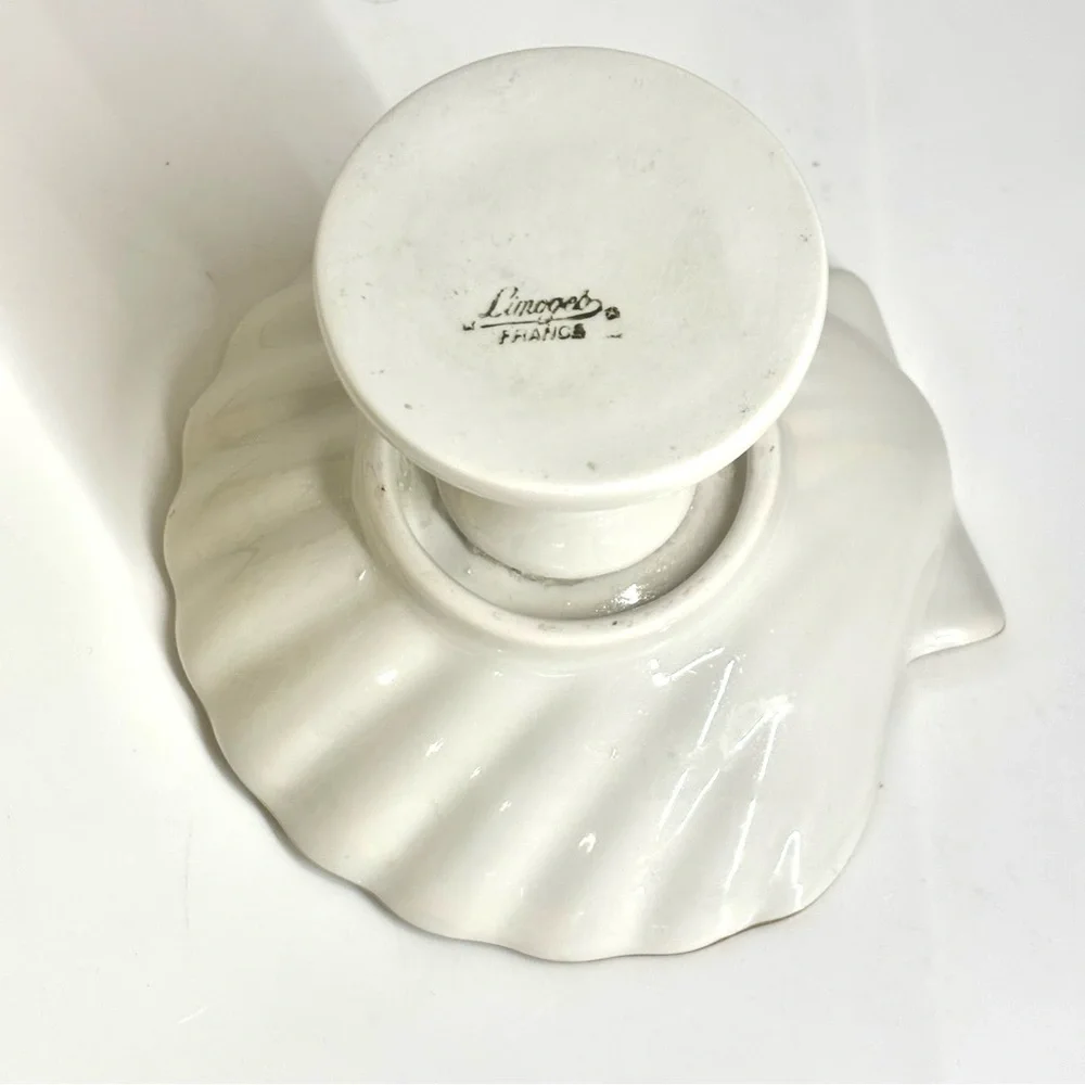 Vintage Limoges France porcelain shell-shaped pedestal dish.